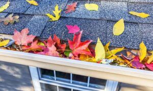 Fall home maintenance checklist with tools, leaves, and a house background – seasonal HVAC and home upkeep tips