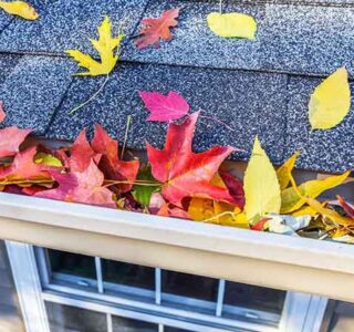 Fall home maintenance checklist with tools, leaves, and a house background – seasonal HVAC and home upkeep tips